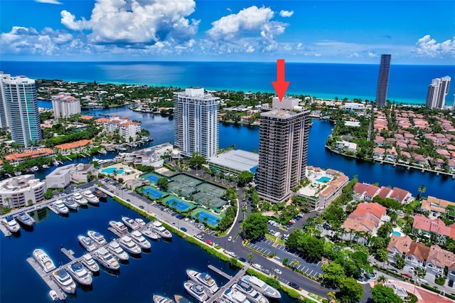 birds eye view of property with a water view