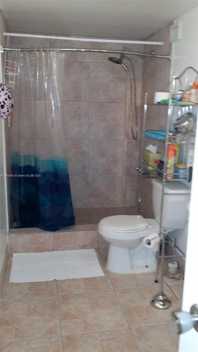 bathroom featuring toilet and tile patterned floors