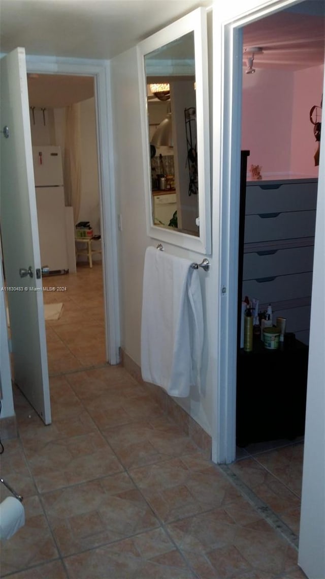 corridor featuring tile patterned flooring