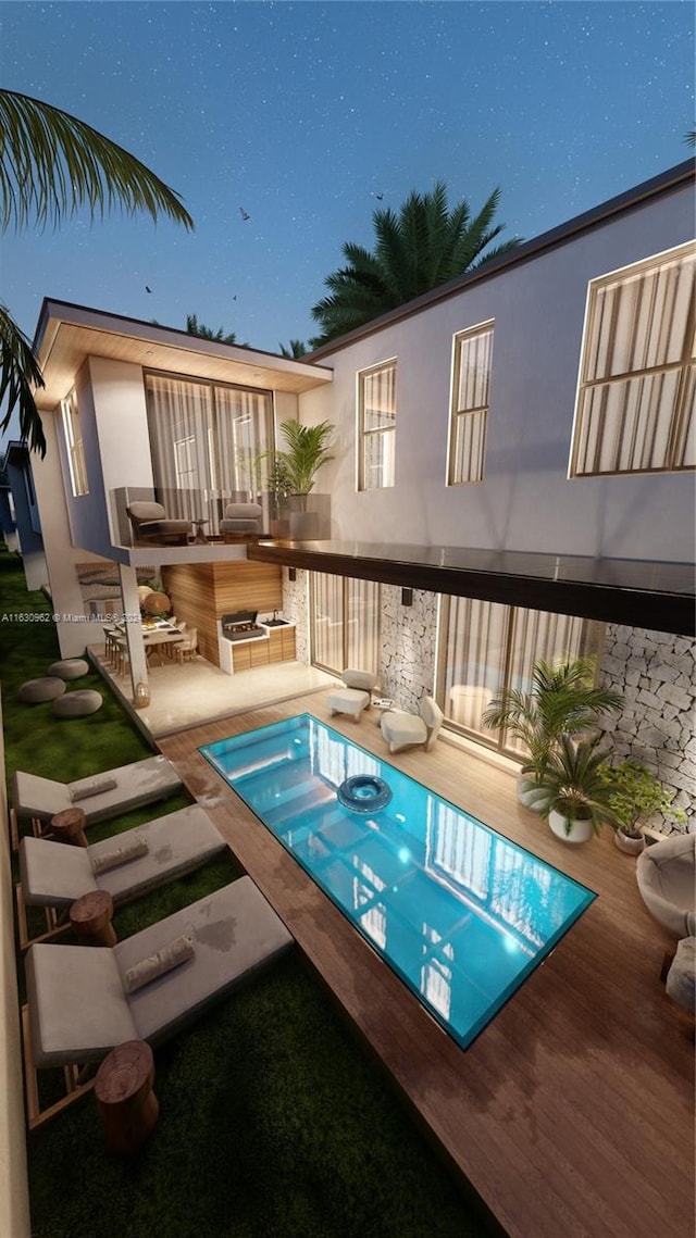 view of pool with a wooden deck and a hot tub