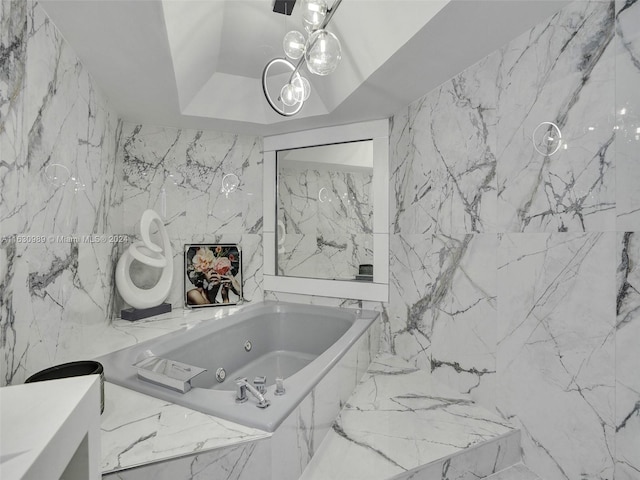 bathroom featuring tile walls and a bath