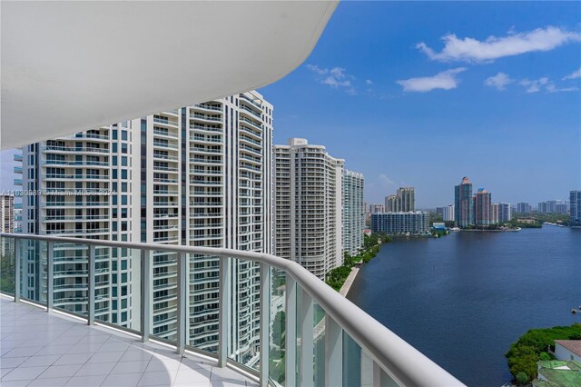 balcony featuring a water view