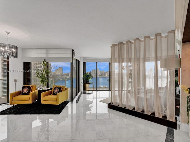 interior space with a water view and a chandelier