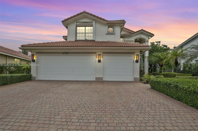 view of front of property with a garage