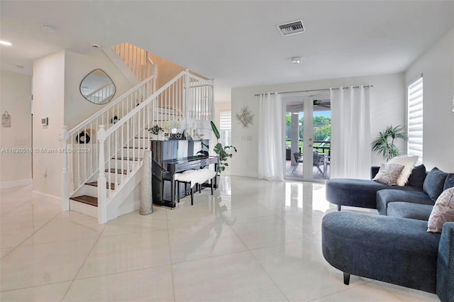 living room with light tile patterned floors and french doors