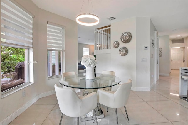 dining area featuring plenty of natural light and light tile patterned floors