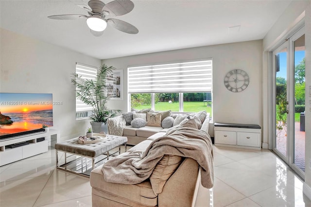 tiled living room featuring ceiling fan