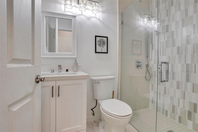 bathroom with vanity, toilet, and walk in shower