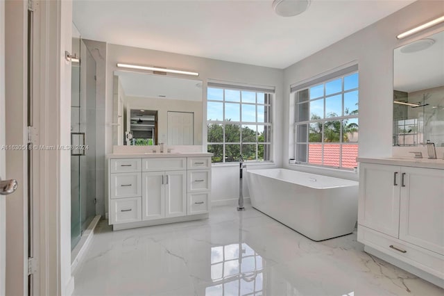 bathroom featuring plus walk in shower and vanity