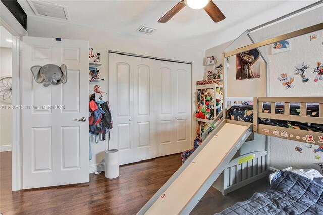 bedroom featuring a closet, ceiling fan, and dark wood-type flooring