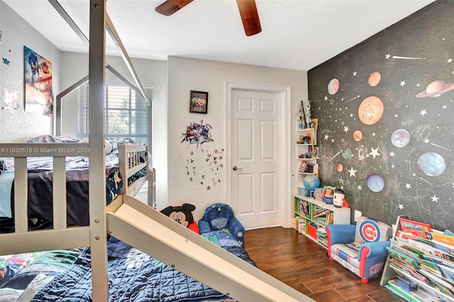 bedroom with ceiling fan and hardwood / wood-style floors