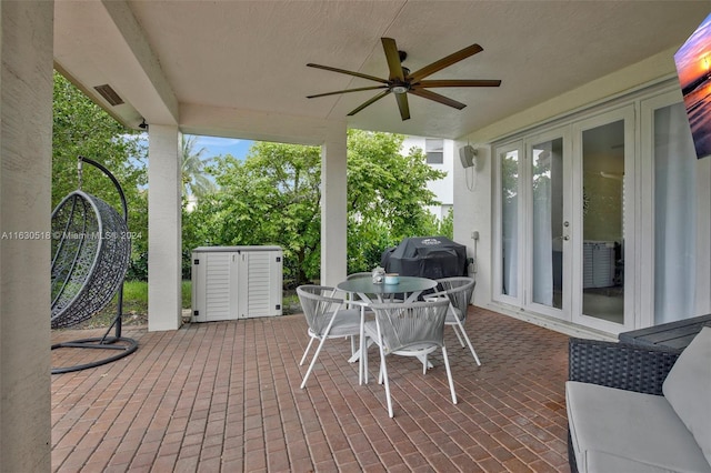 view of patio / terrace with grilling area, french doors, and ceiling fan