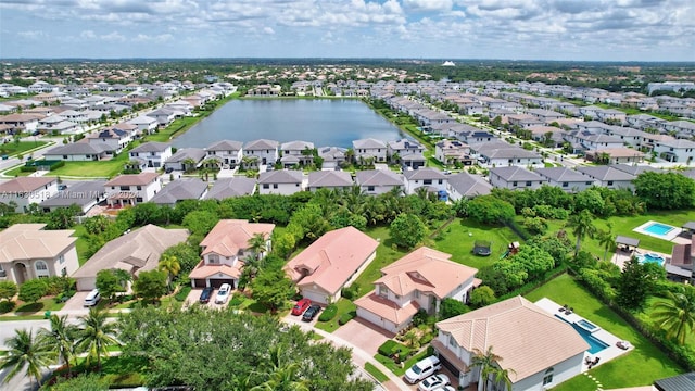 birds eye view of property with a water view