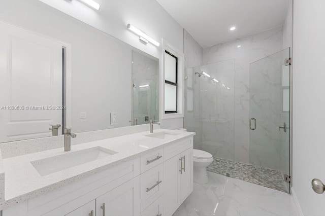 full bathroom featuring a marble finish shower, marble finish floor, a sink, and toilet