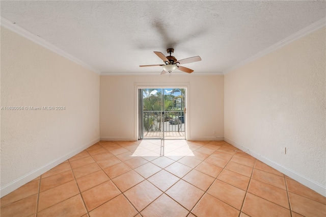 tiled spare room with a textured ceiling, ceiling fan, and crown molding