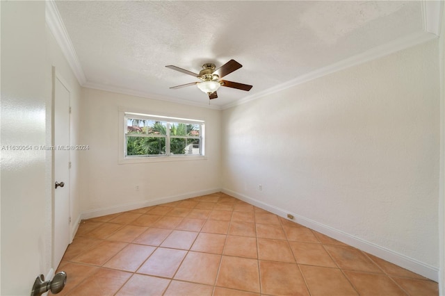 tiled empty room featuring a textured ceiling, ceiling fan, and crown molding