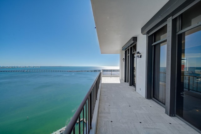 balcony featuring a water view