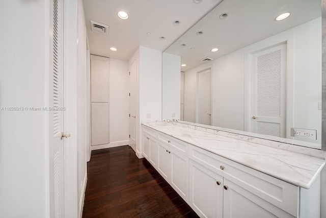 bathroom with vanity and hardwood / wood-style floors