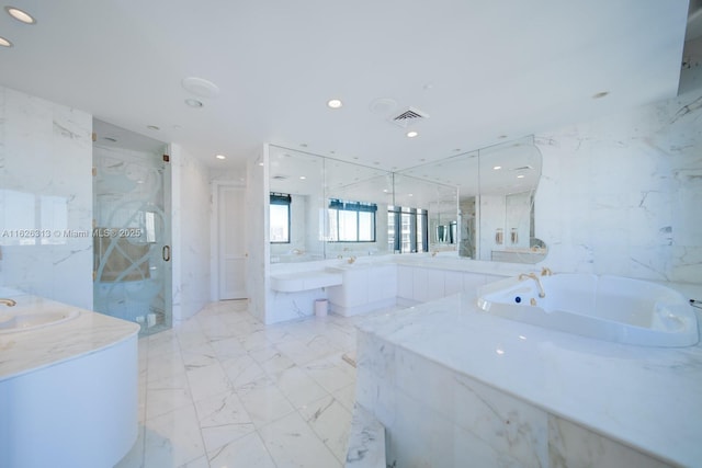 bathroom with vanity, plus walk in shower, and tile walls