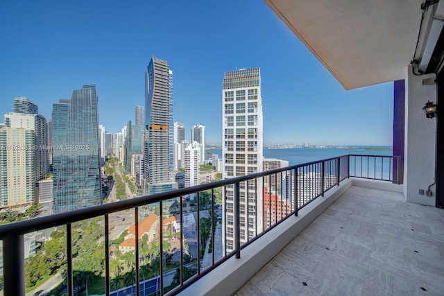 balcony featuring a water view