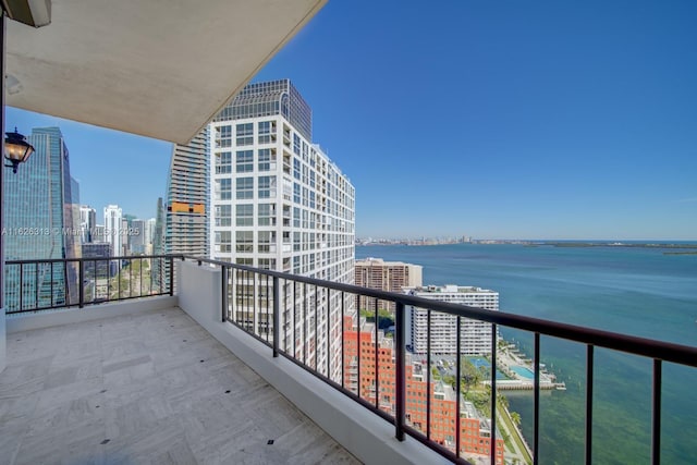 balcony featuring a water view