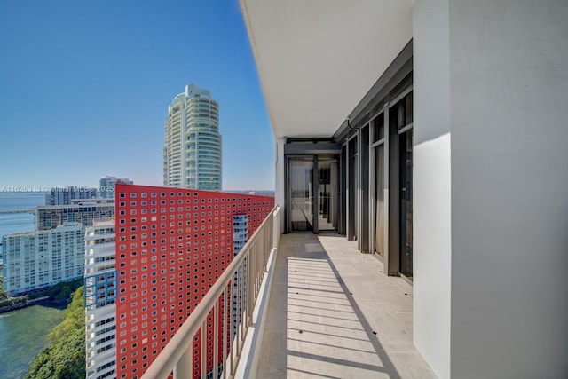 balcony featuring a water view