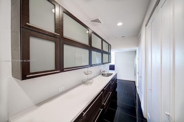 bathroom with vanity and tile patterned flooring