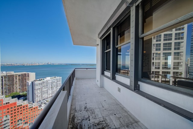 balcony featuring a water view