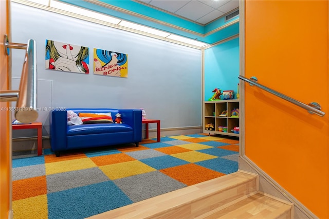 game room featuring a drop ceiling