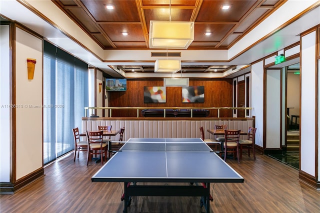 game room with crown molding, coffered ceiling, and dark hardwood / wood-style flooring