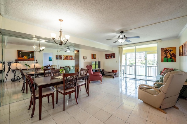 dining space featuring ceiling fan with notable chandelier, ornamental molding, light tile patterned floors, and a textured ceiling