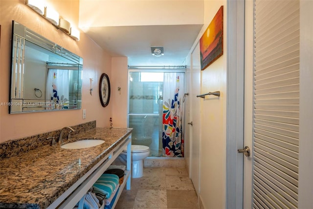 bathroom with vanity, toilet, and tile patterned flooring