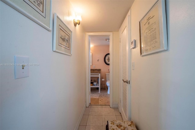 corridor featuring light tile patterned floors