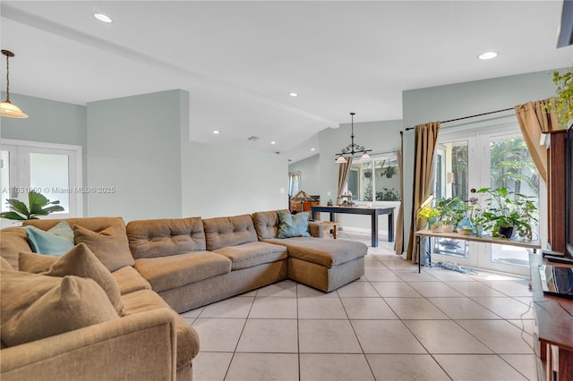 living area featuring light tile patterned floors, recessed lighting, and lofted ceiling