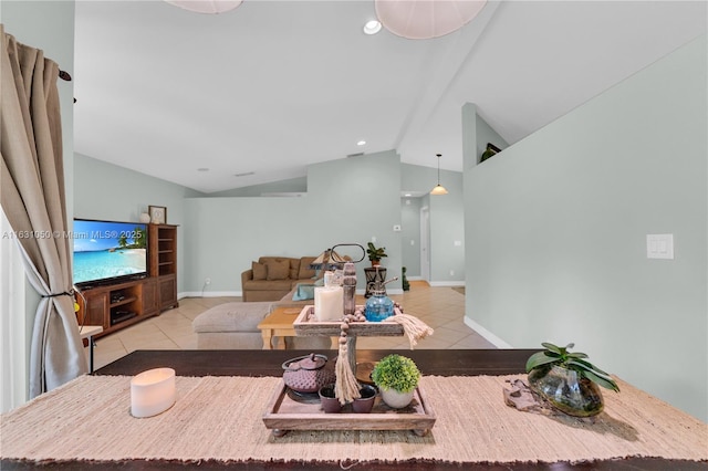 living area featuring lofted ceiling, light tile patterned flooring, and baseboards