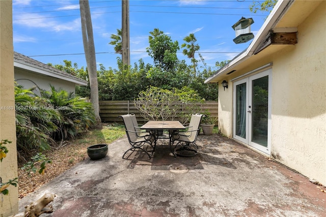 view of patio / terrace with outdoor dining space and fence