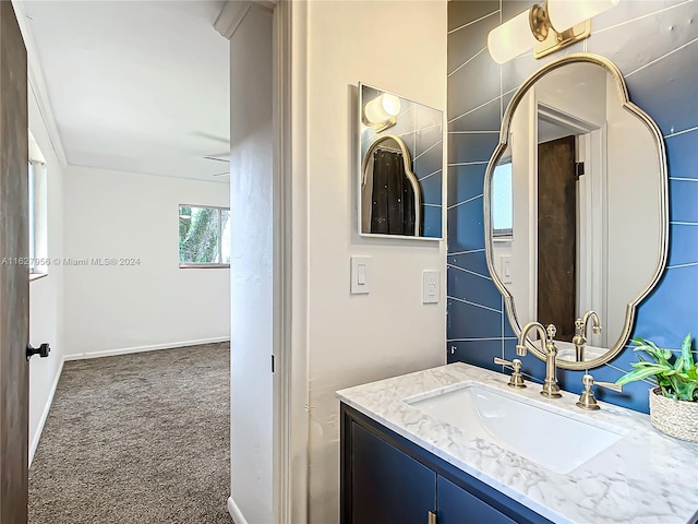 bathroom with tile walls and vanity