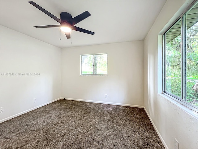 empty room with carpet flooring and ceiling fan