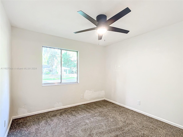 spare room featuring carpet flooring and ceiling fan