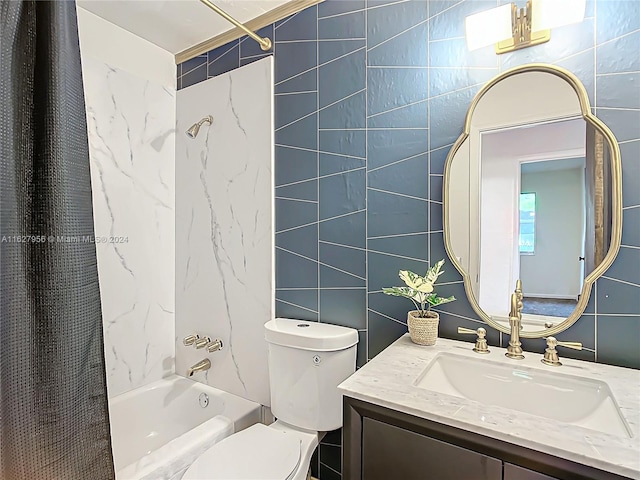 full bathroom with vanity, shower / bath combo with shower curtain, tile walls, and toilet