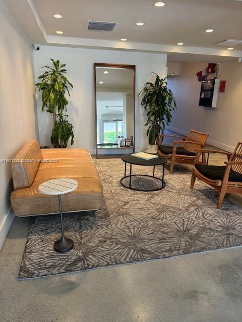 sitting room with baseboards, visible vents, and recessed lighting