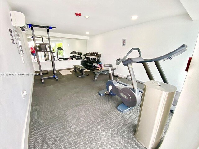 exercise room featuring a wall mounted air conditioner