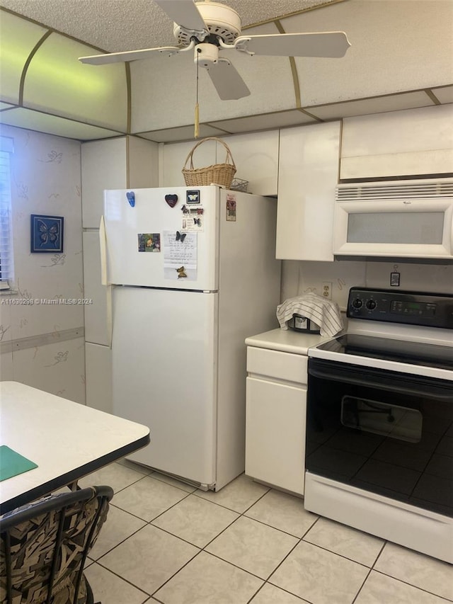 kitchen featuring light countertops, a ceiling fan, light tile patterned floors, white appliances, and white cabinets