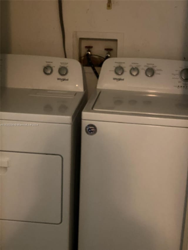 clothes washing area featuring independent washer and dryer