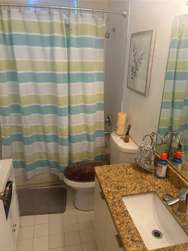 full bathroom featuring vanity, shower / bathtub combination with curtain, tile patterned flooring, and toilet