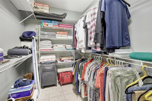 spacious closet with light tile patterned flooring