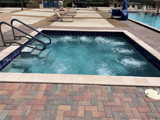 view of pool featuring a patio area