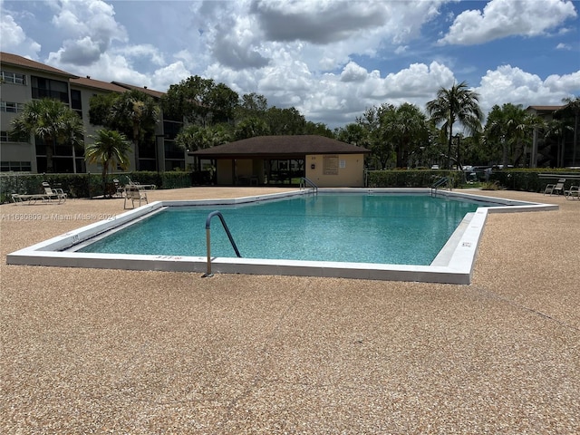 view of pool featuring a patio