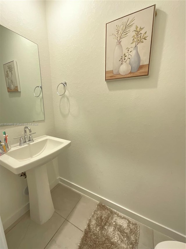 bathroom with tile patterned floors