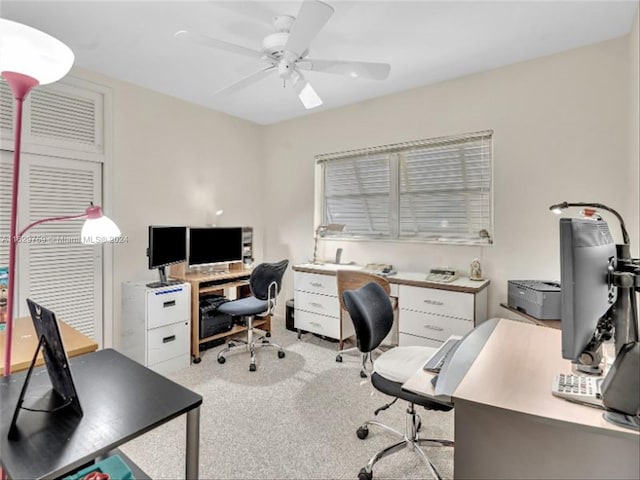 office space with light colored carpet and ceiling fan